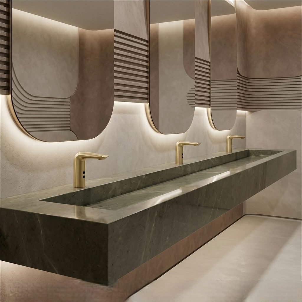 Luxury restroom interior featuring premium gold-finish commercial accessories